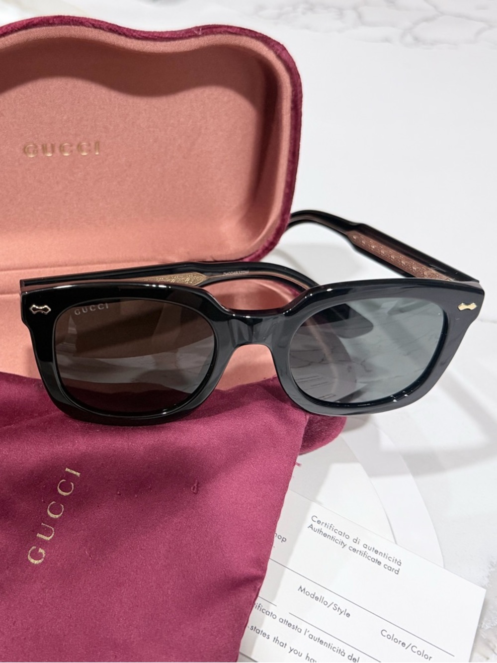 Gucci Black Frame Sunglasses with Dark Lenses